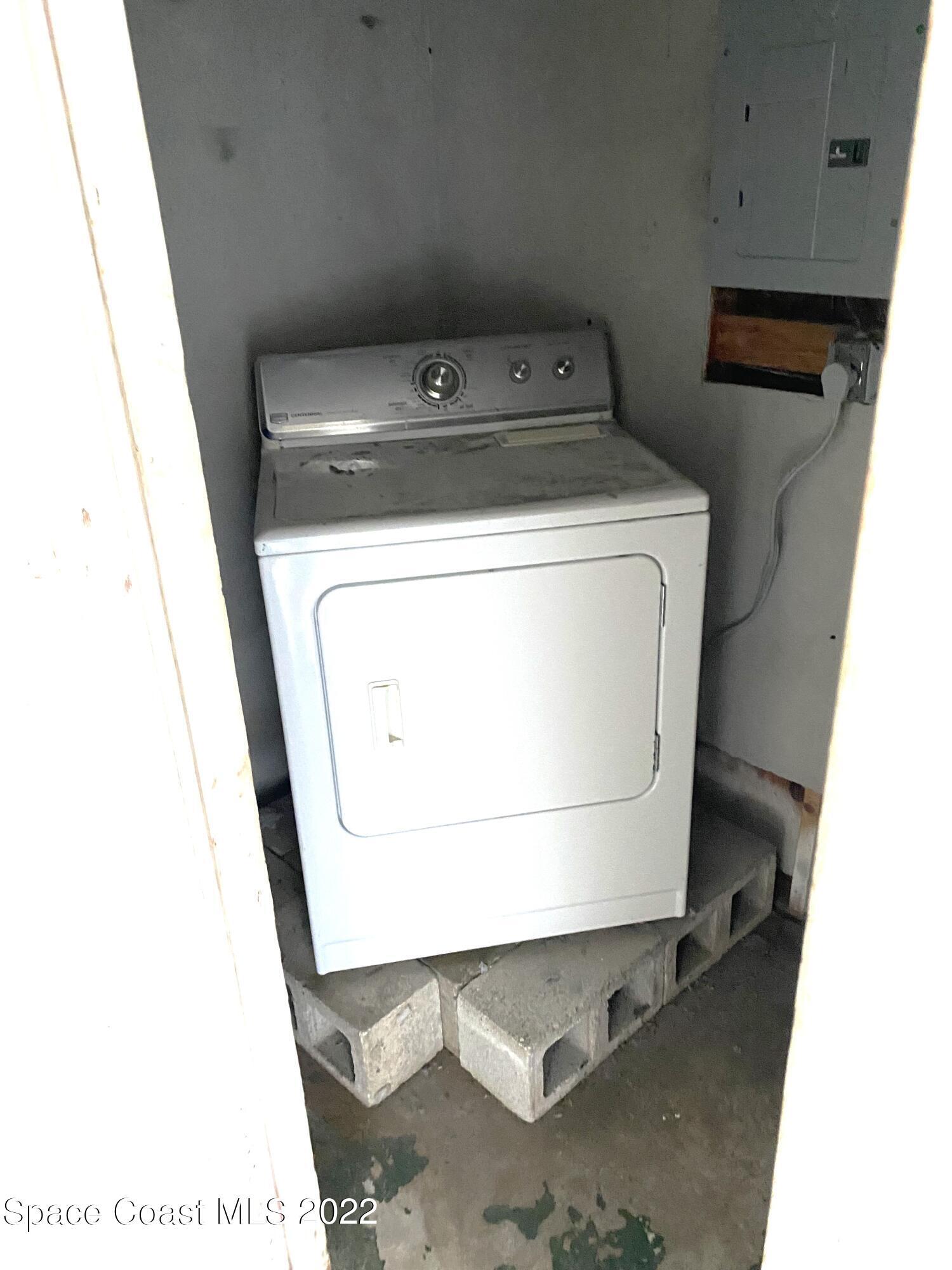 1199 Jordan Court Northeast, Unit B Palm Bay, FL 32905 - Photo 16 of 20 a utility room with dryer and washer