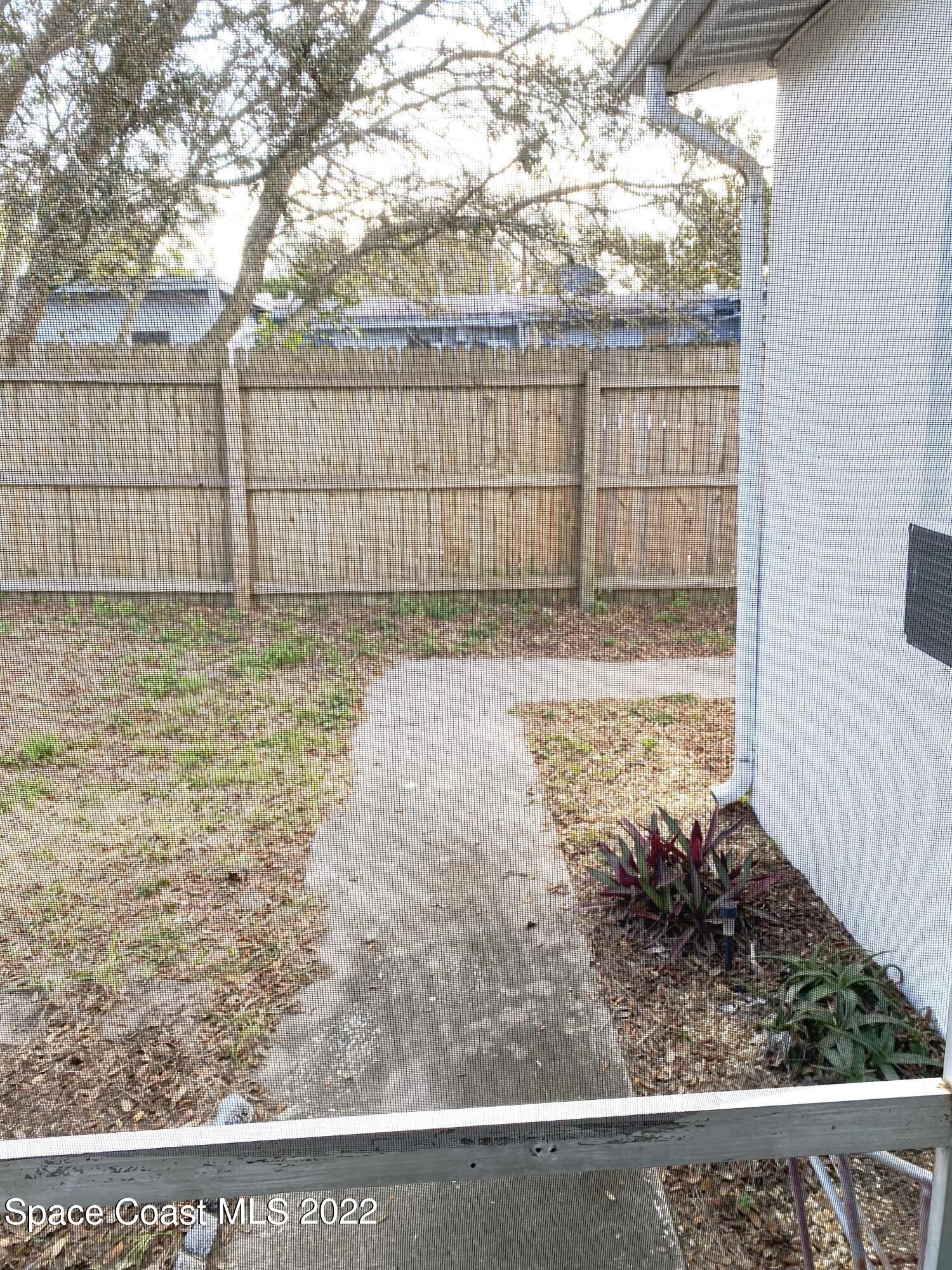 1199 Jordan Court Northeast, Unit B Palm Bay, FL 32905 - Photo 19 of 20 a view of a backyard