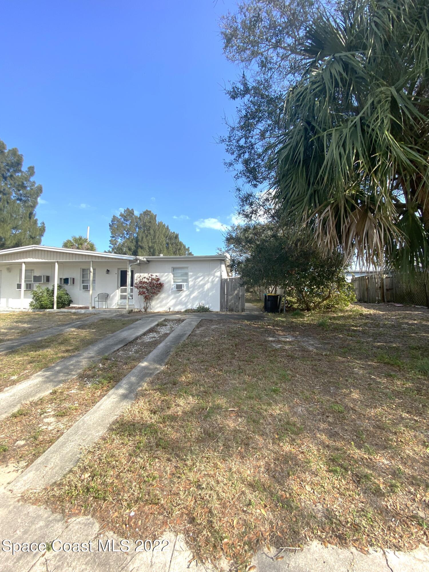 1199 Jordan Court Northeast, Unit B Palm Bay, FL 32905 - Photo 20 of 20 a view of house with outdoor space and trees in the background