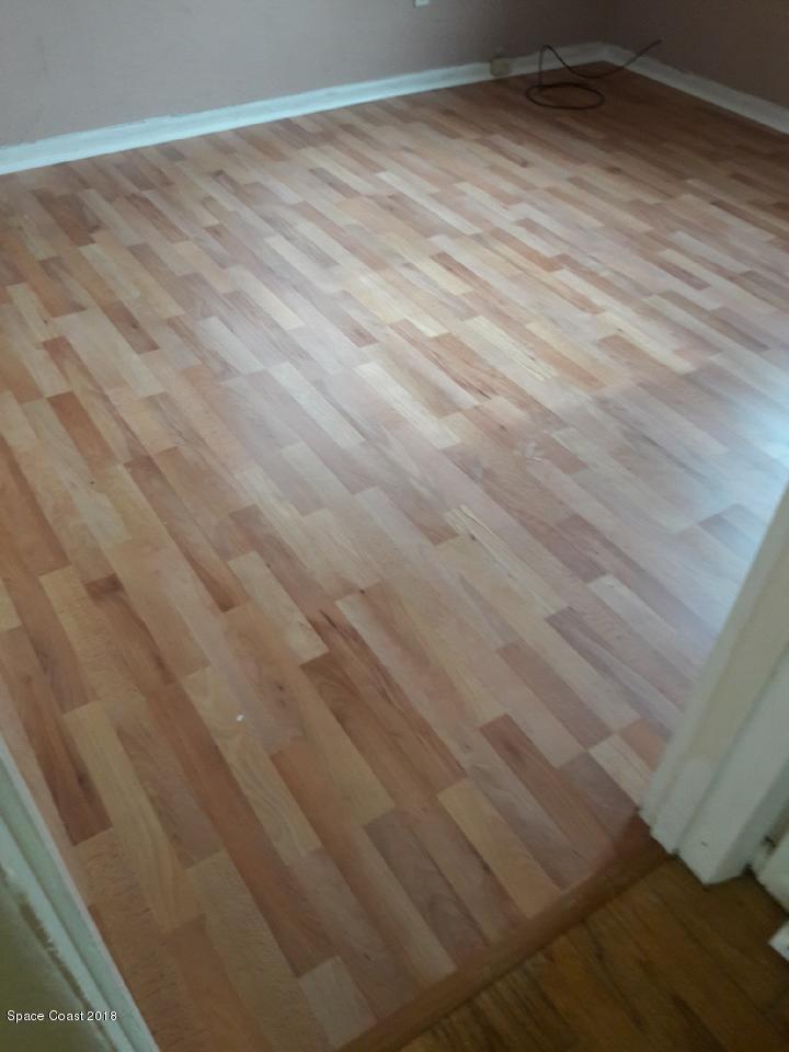 1199 Jordan Court Northeast, Unit B Palm Bay, FL 32905 - Photo 7 of 20 a view of a room with wooden floor