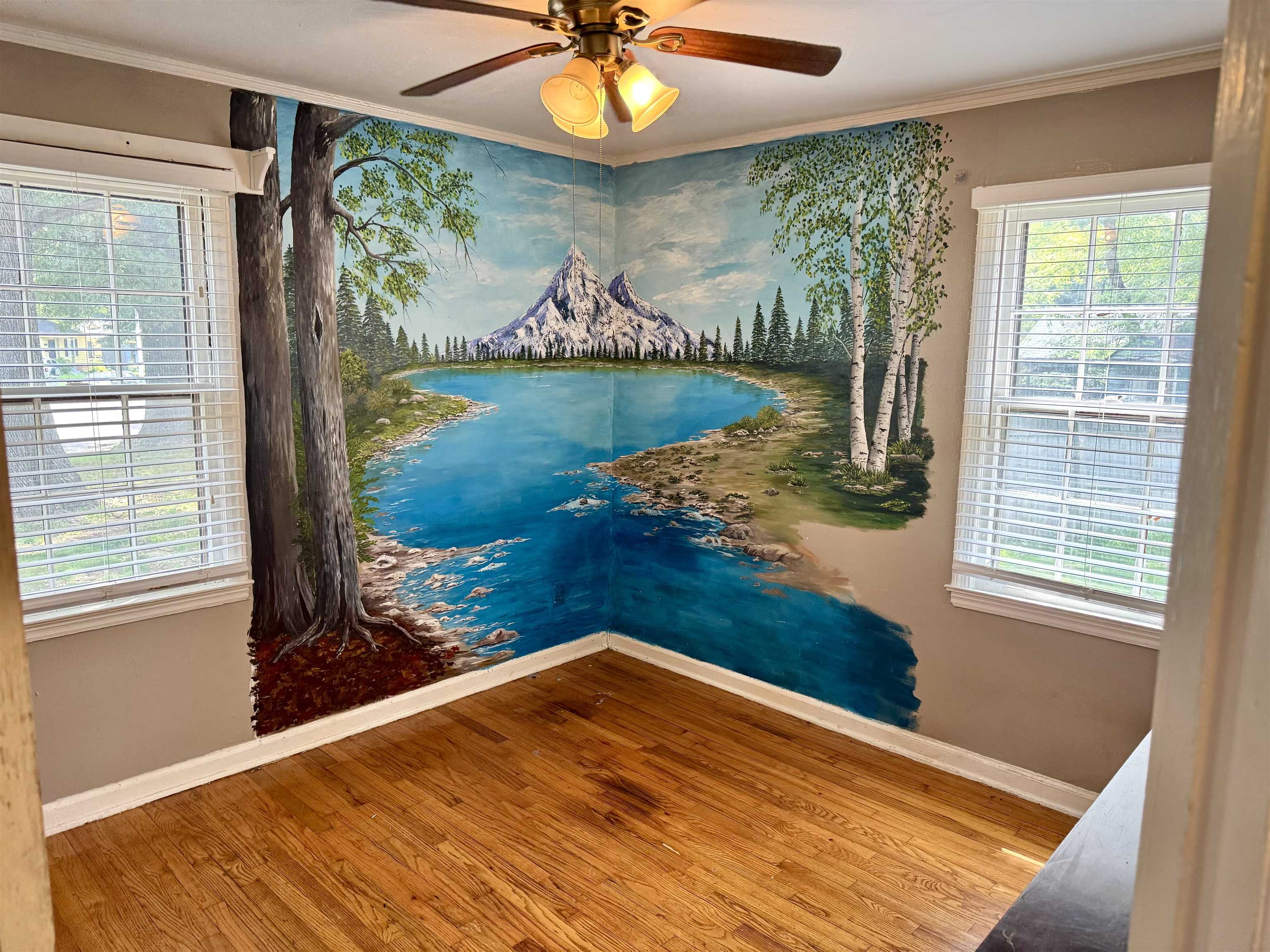 3787 Rhodes Avenue Memphis, TN 38111 - Photo 13 of 23 Wood floors, molding, and a ceiling fan