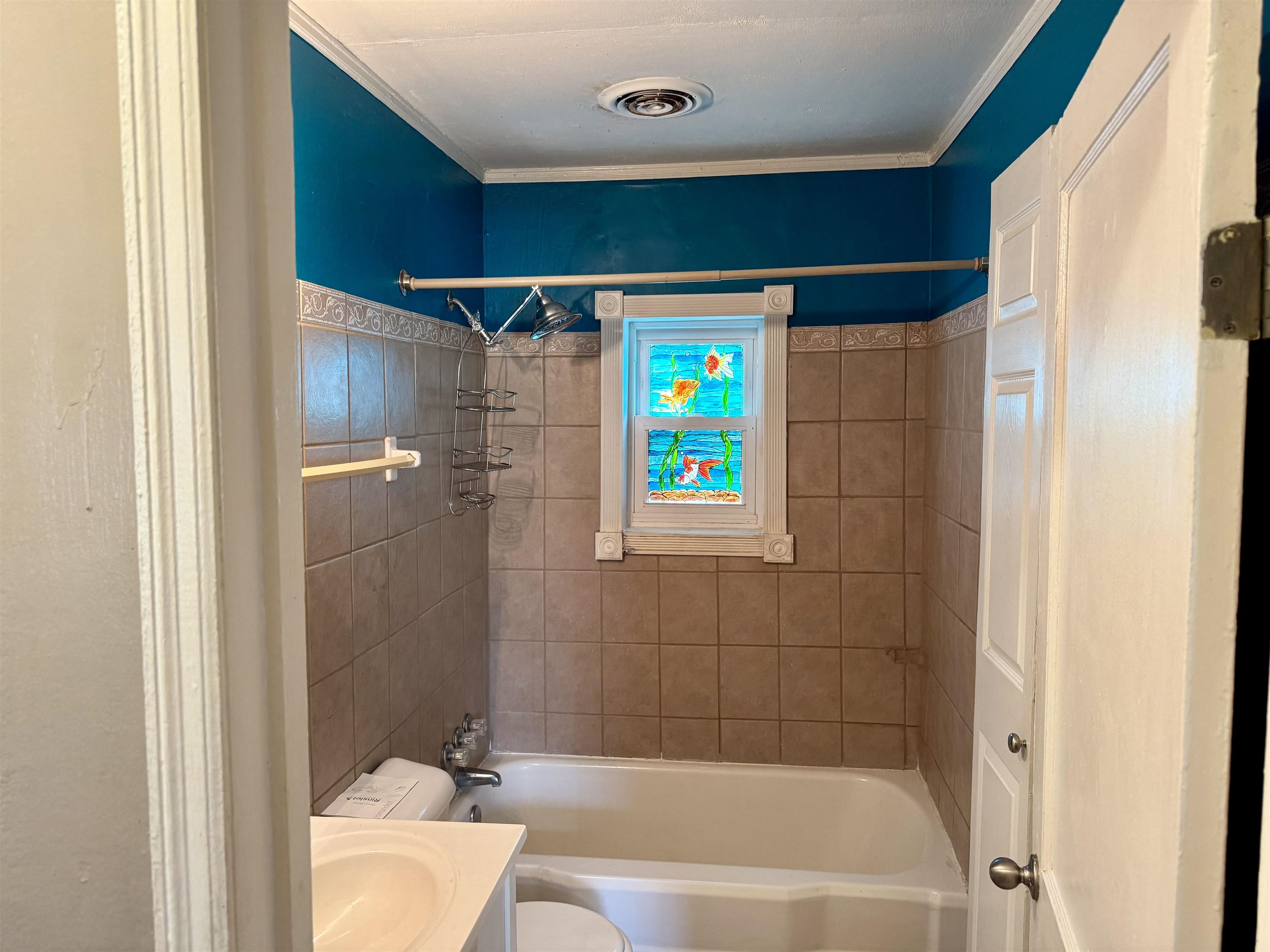 3787 Rhodes Avenue Memphis, TN 38111 - Photo 14 of 23 Bathroom featuring shower / bath combination, vanity, and ornamental molding