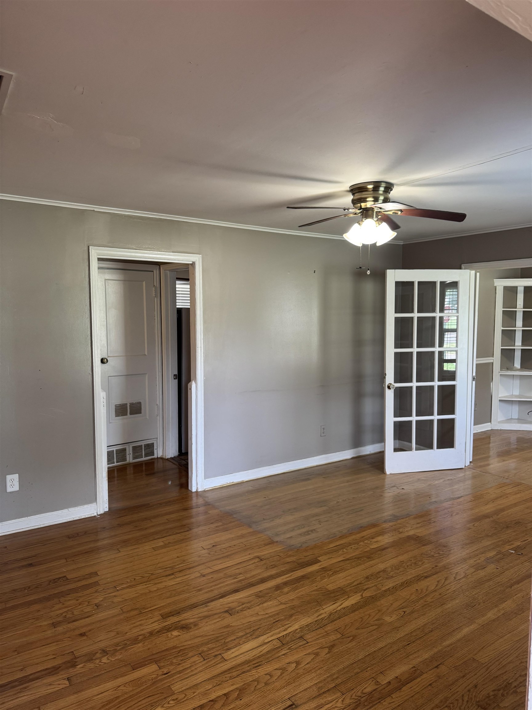 3787 Rhodes Avenue Memphis, TN 38111 - Photo 8 of 23 Unfurnished room featuring a ceiling fan and wood finished floors