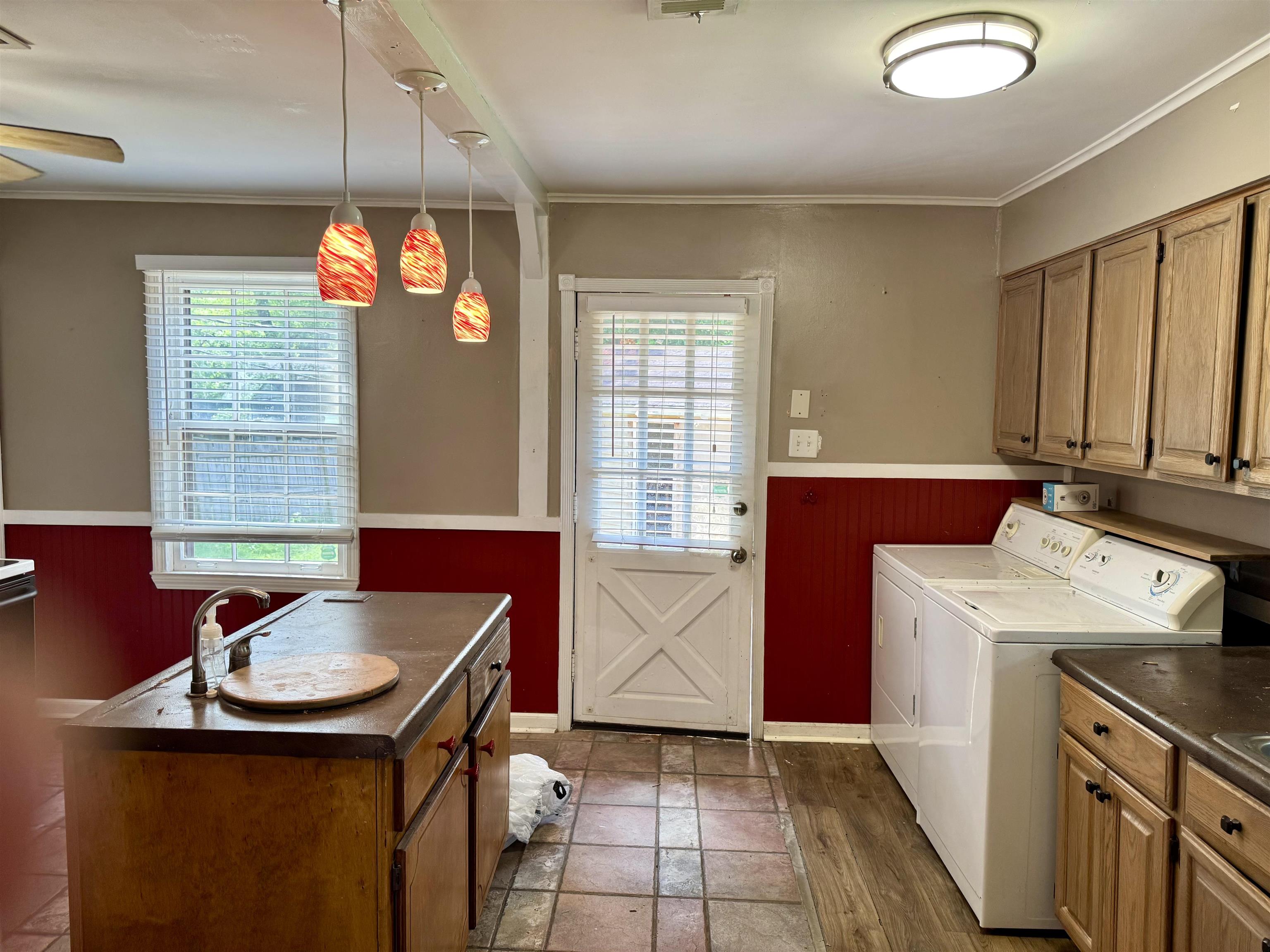 3787 Rhodes Avenue Memphis, TN 38111 - Photo 9 of 23 Washer and clothes dryer included, wainscoting, ceiling fan, crown molding, and cabinet space