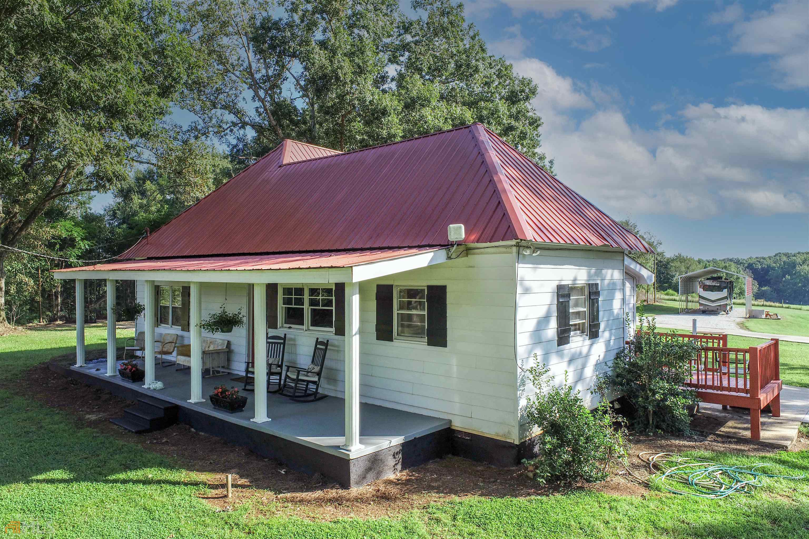960 Shirley Road Royston, GA 30662 - Photo 1 of 1 a view of a house with a yard balcony and plants