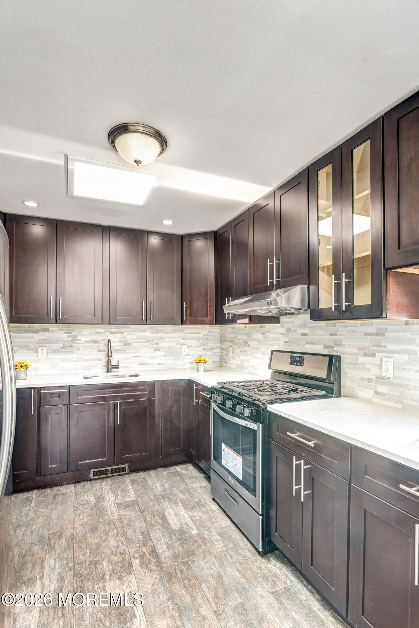 Main Street Milltown, NJ 08850 - Photo 11 of 37 a large kitchen with granite countertop a sink and cabinets