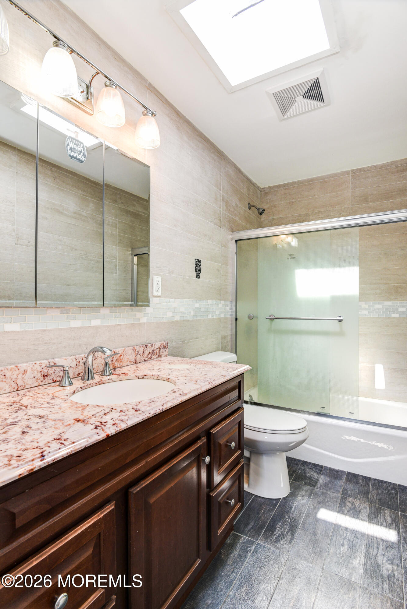 Main Street Milltown, NJ 08850 - Photo 15 of 37 a bathroom with a granite countertop sink toilet and mirror