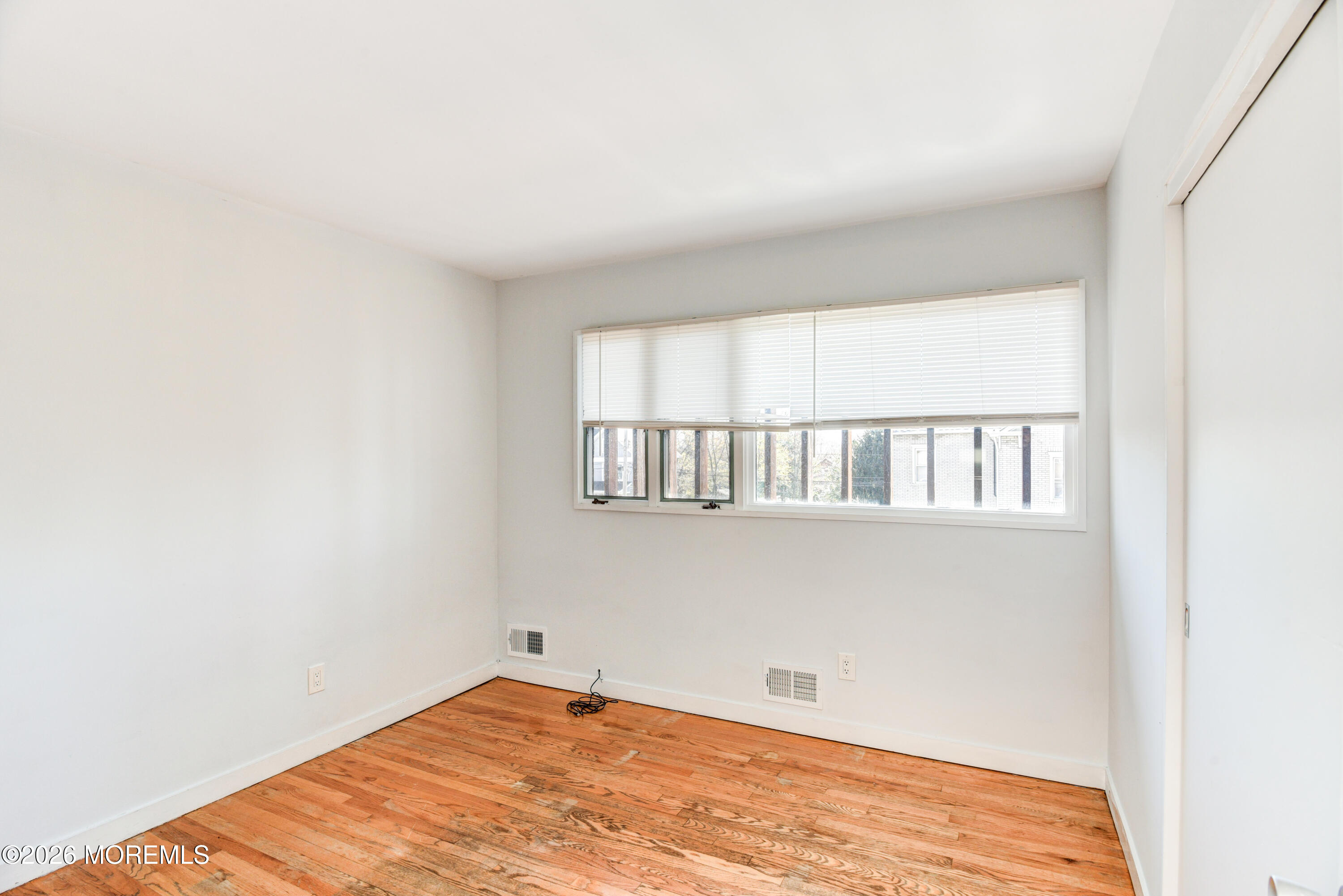 Main Street Milltown, NJ 08850 - Photo 16 of 37 a view of empty room with wooden floor