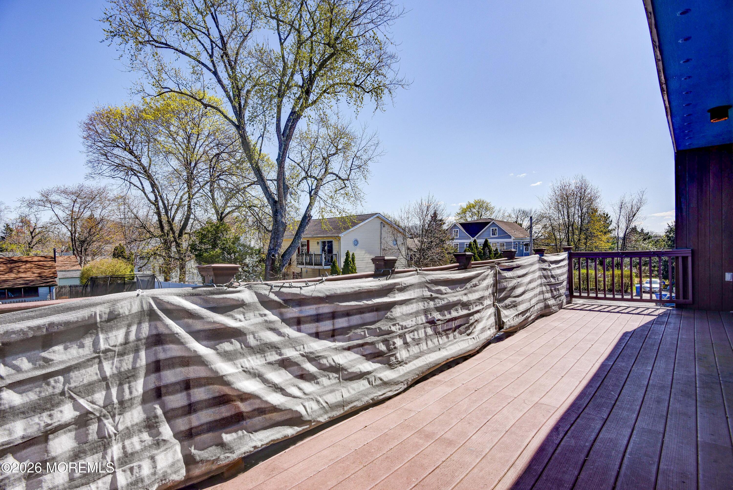 Main Street Milltown, NJ 08850 - Photo 18 of 37 a view of a wooden deck with a yard