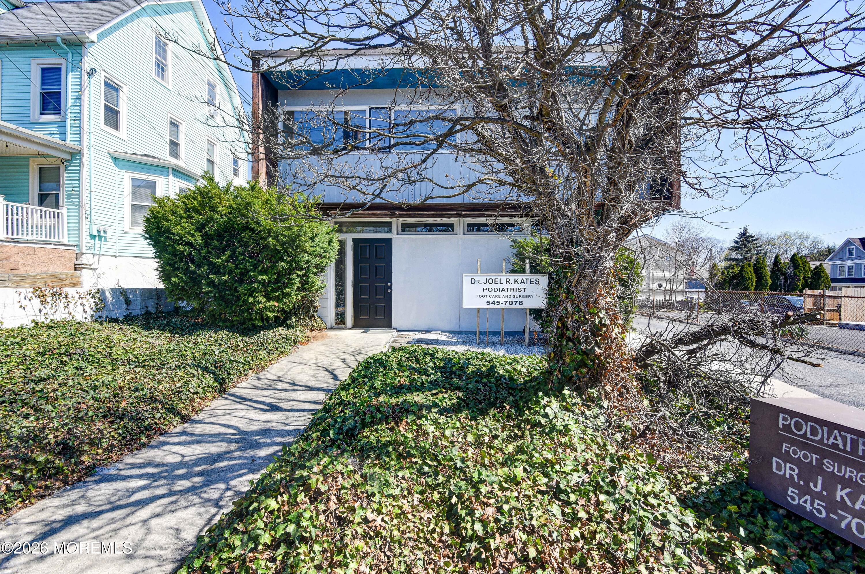 Main Street Milltown, NJ 08850 - Photo 2 of 37 a front view of a house with a yard and garage