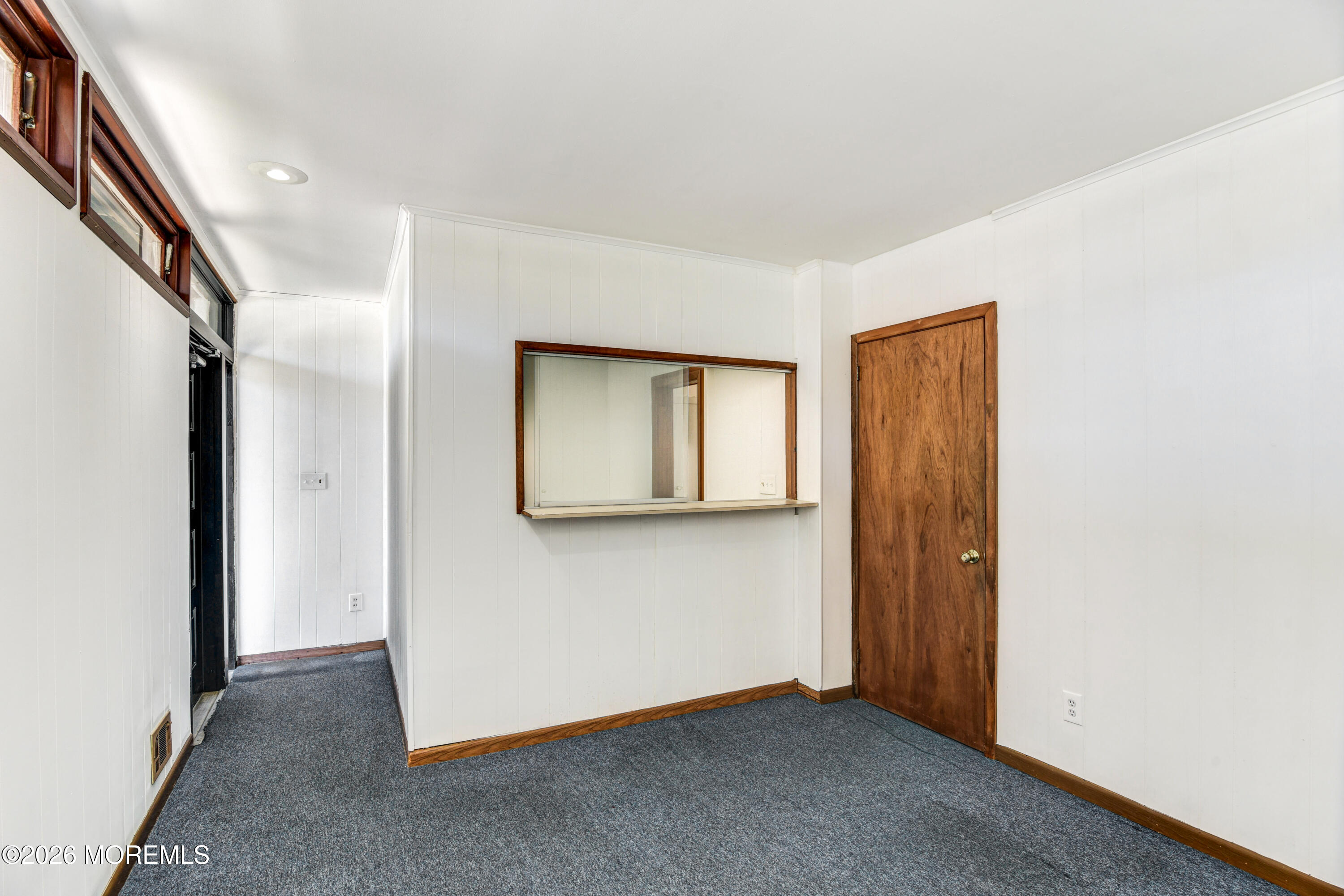 Main Street Milltown, NJ 08850 - Photo 21 of 37 a view of an empty room with closet and mirror