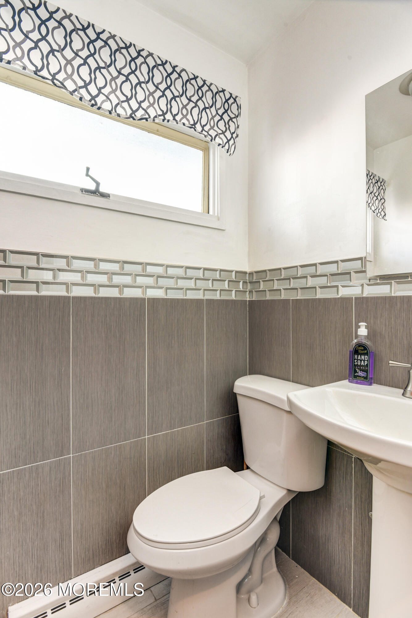 Main Street Milltown, NJ 08850 - Photo 26 of 37 a bathroom with a toilet a sink and mirror