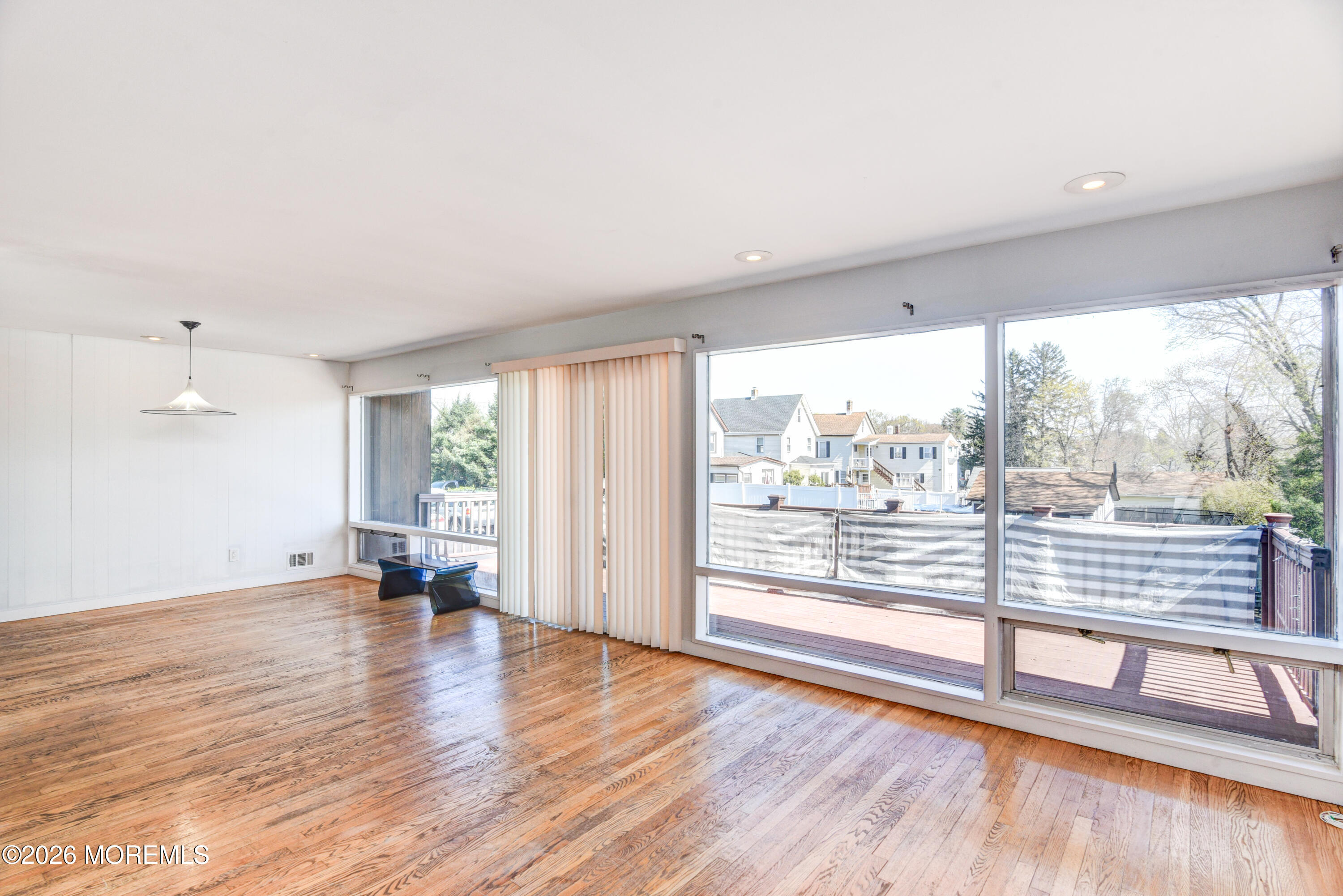 Main Street Milltown, NJ 08850 - Photo 4 of 37 an empty room with wooden floor and windows