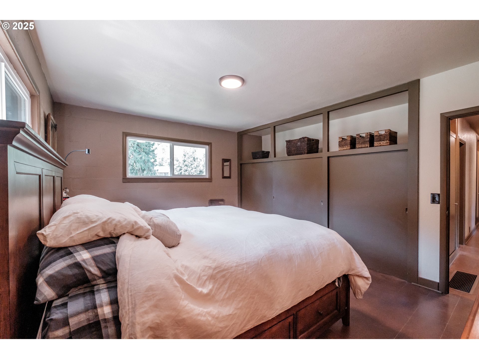 9602 Harlan Road Eddyville, OR 97343 - Photo 17 of 48 a bedroom with a bed and a large mirror