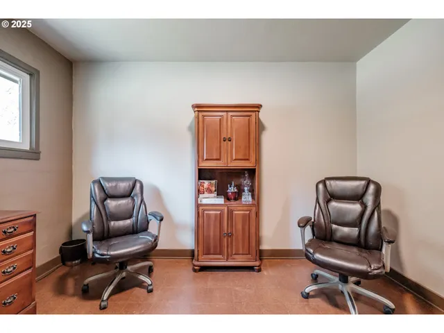 a living room with furniture and a chair