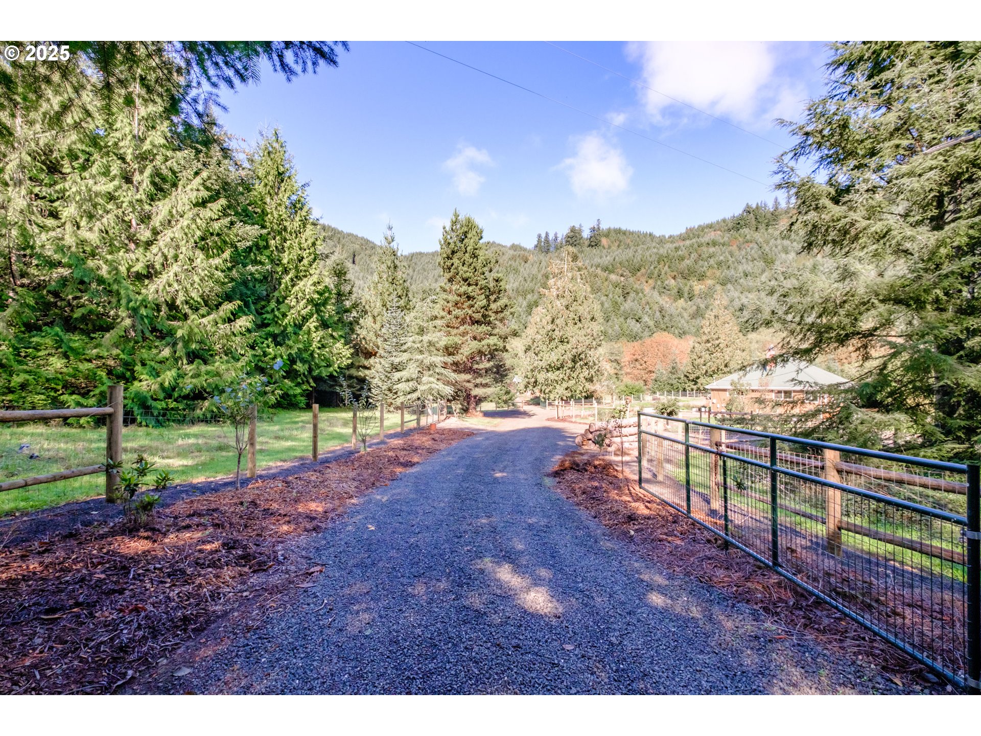 9602 Harlan Road Eddyville, OR 97343 - Photo 4 of 48 a view of a yard with wooden fence
