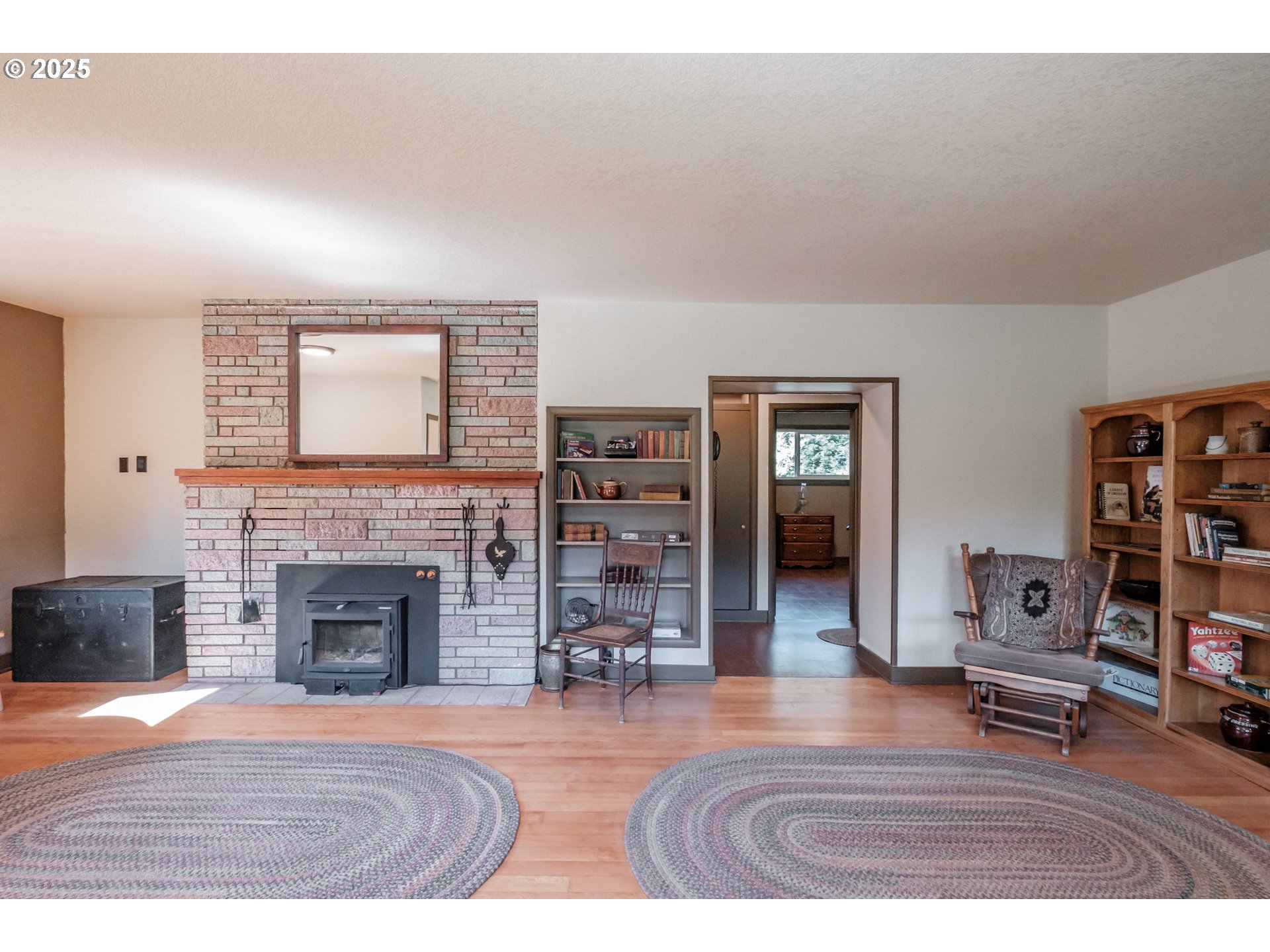9602 Harlan Road Eddyville, OR 97343 - Photo 10 of 48 a living room with furniture and a fireplace