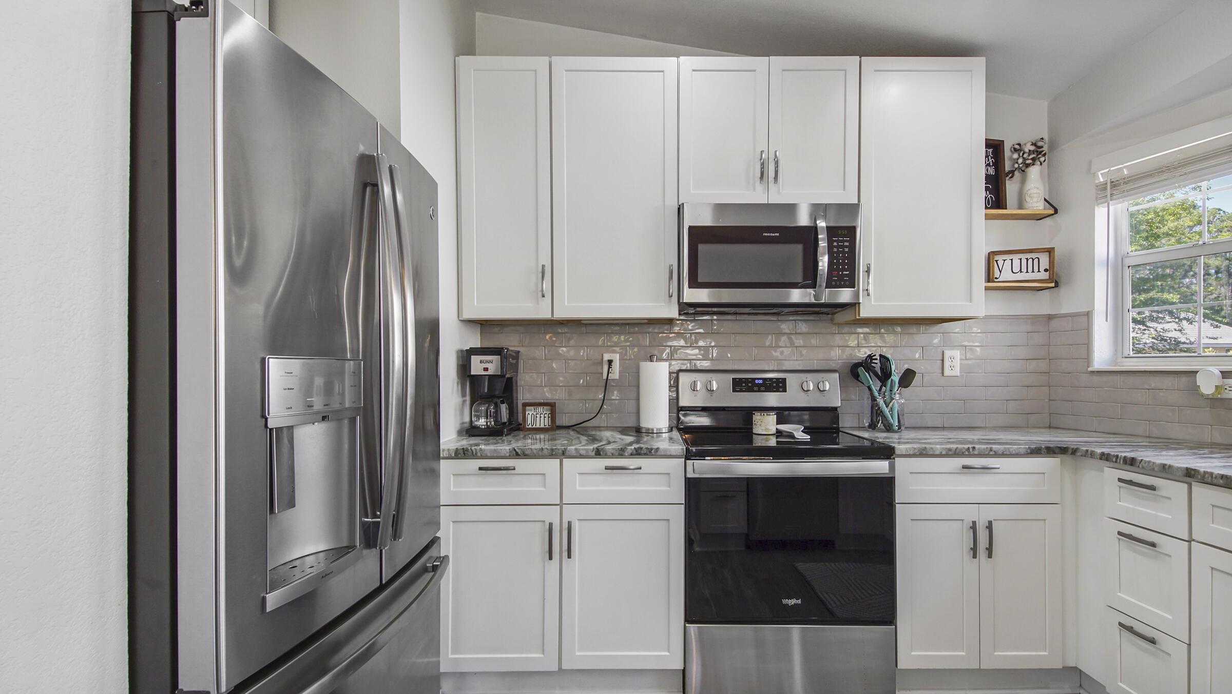 190 Plantation Way Santa Rosa Beach, FL 32459 - Photo 20 of 41 a kitchen with stainless steel appliances granite countertop a refrigerator stove and sink