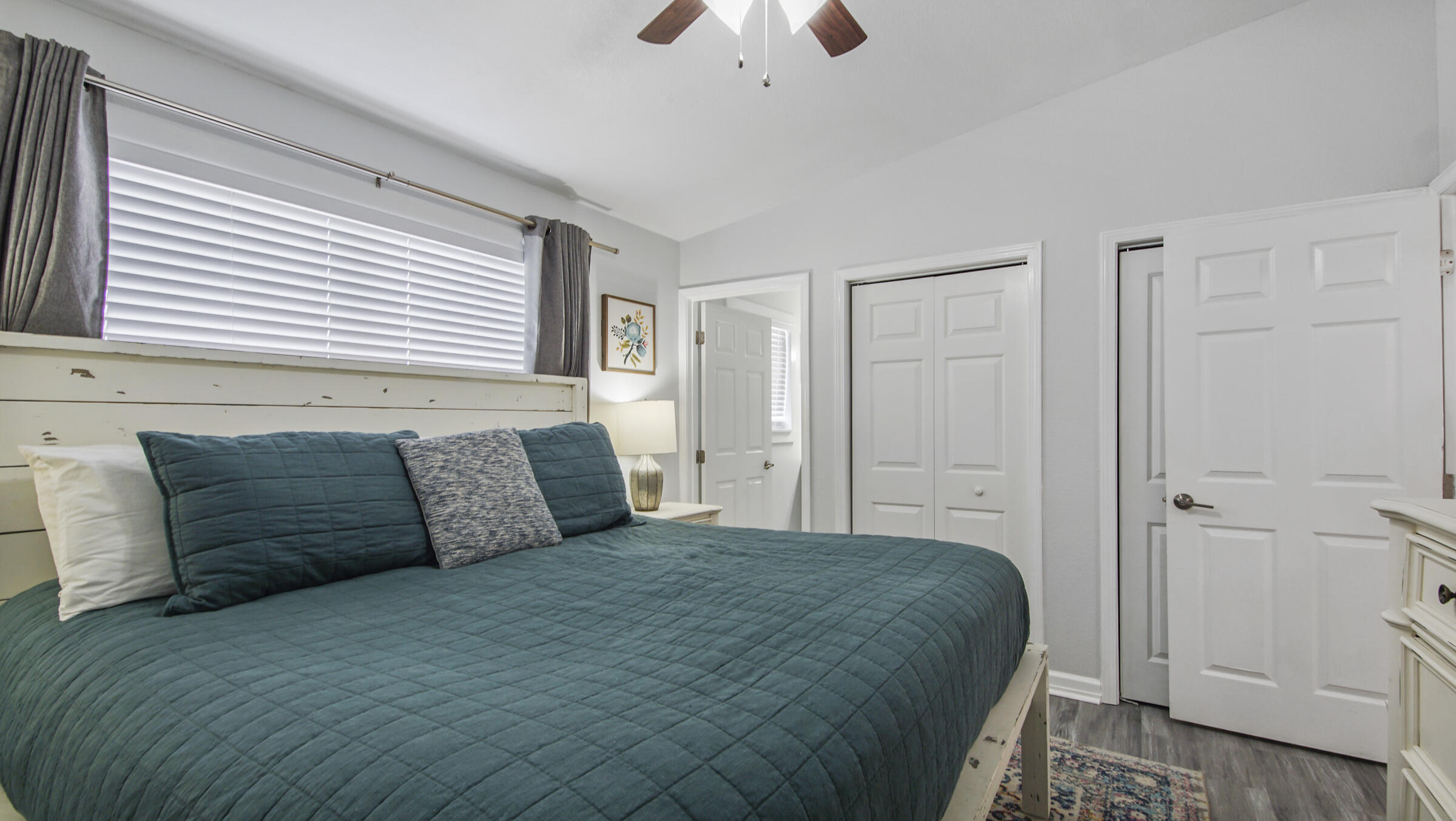 190 Plantation Way Santa Rosa Beach, FL 32459 - Photo 33 of 41 a spacious bedroom with a large bed and a chandelier