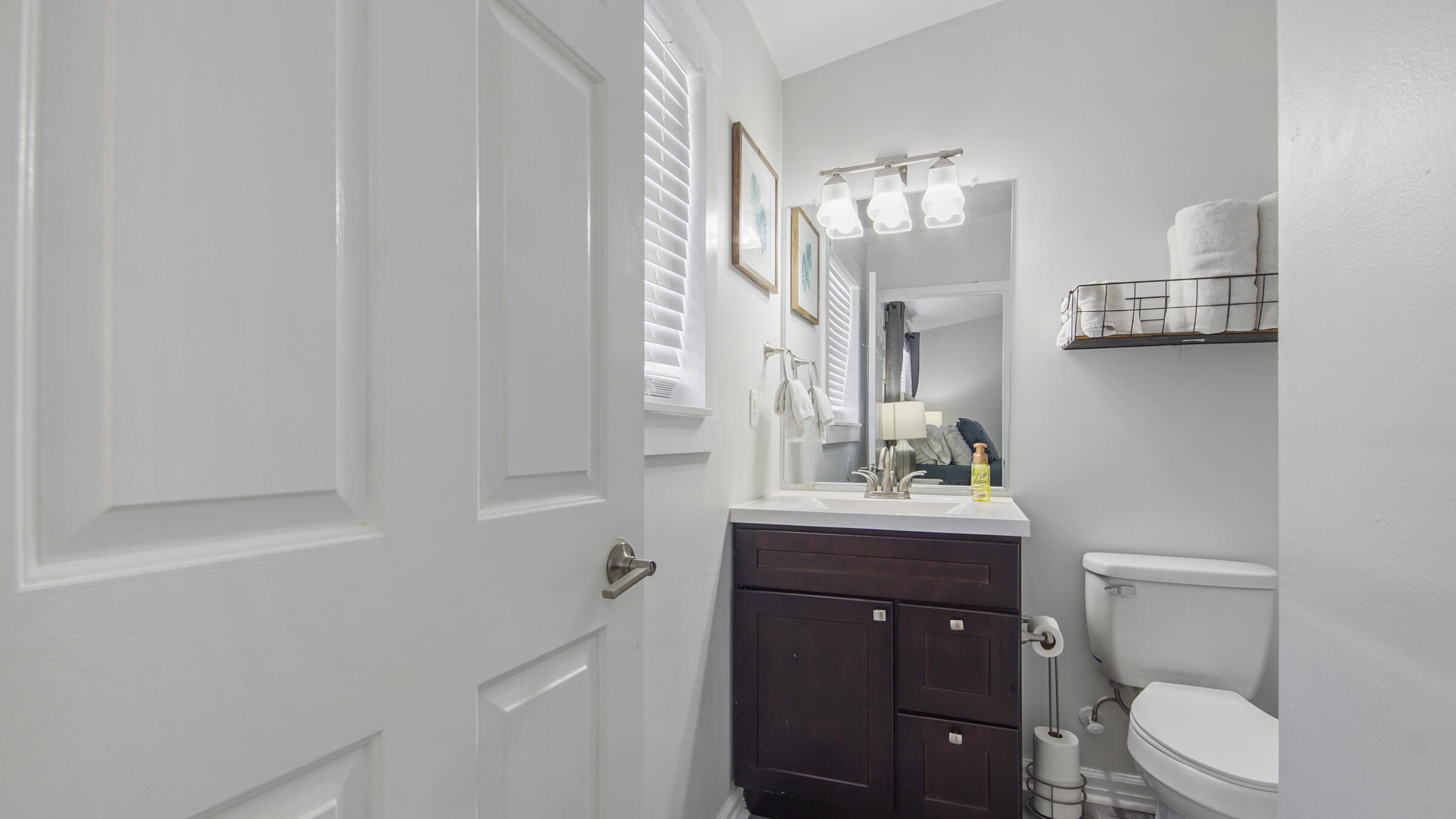 190 Plantation Way Santa Rosa Beach, FL 32459 - Photo 34 of 41 a bathroom with a toilet a sink and mirror