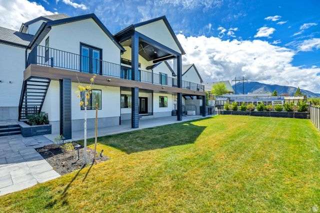 1720 Hillcrest Circle Mapleton, UT 84664 - Photo 103 of 116 Back of house featuring a patio, a mountain view, and stucco siding