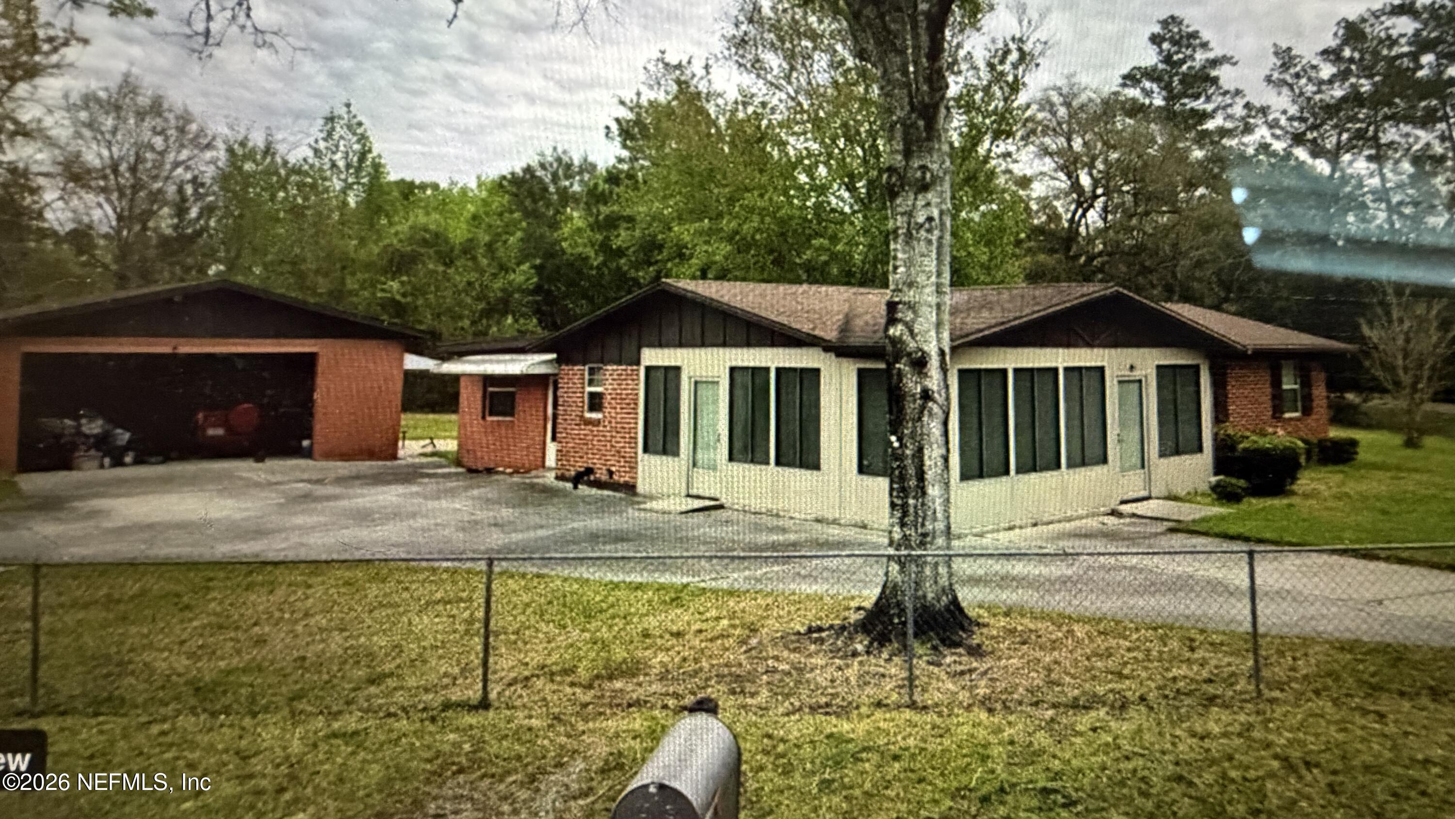 11031 V C Johnson Road Jacksonville, FL 32218 - Photo 1 of 1 a house with trees in the background