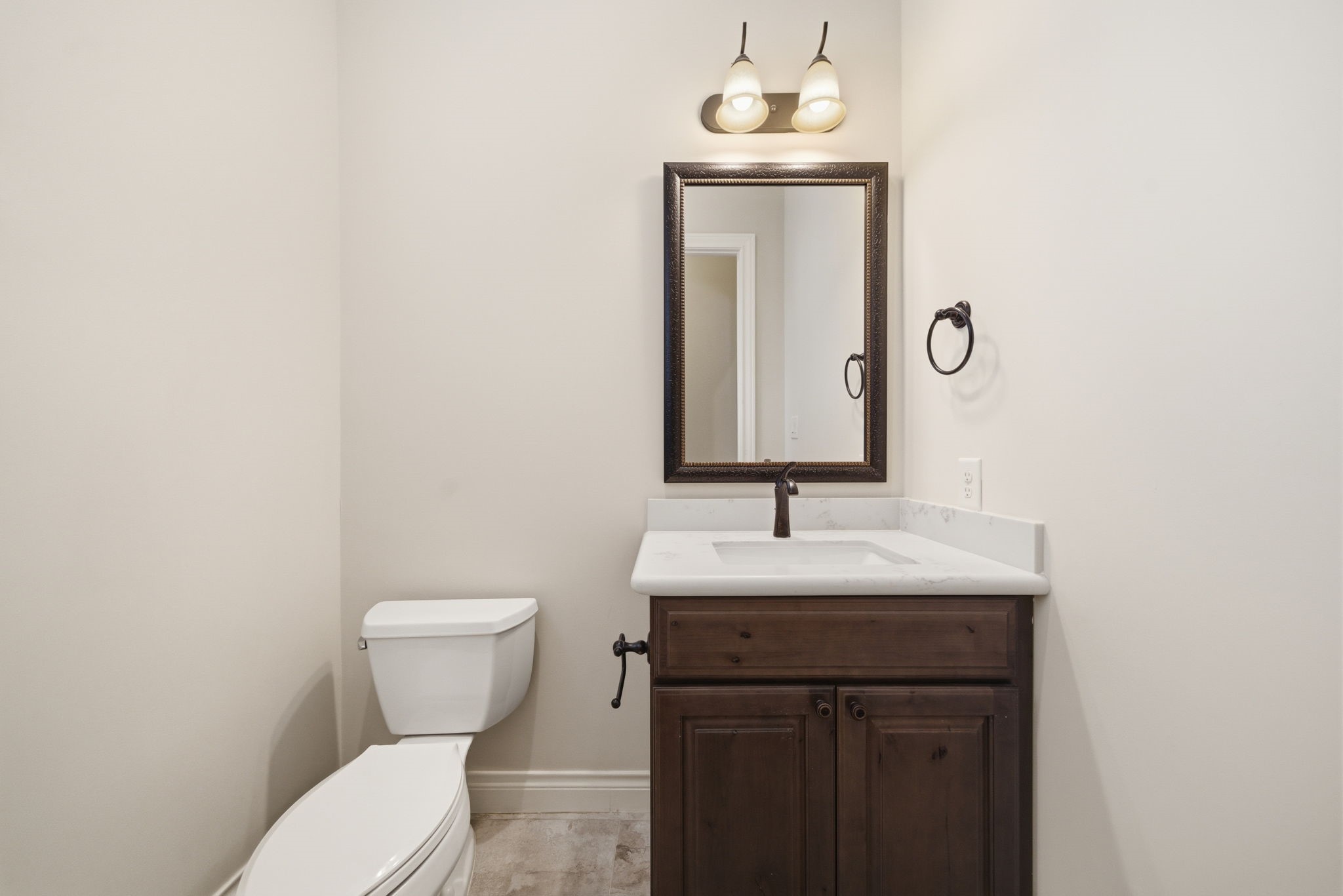 4224 Gibson Street Houston, TX 77007 - Photo 11 of 22 a bathroom with a toilet sink and mirror