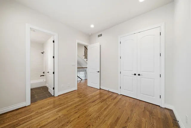a spacious bathroom with a sink and a mirror