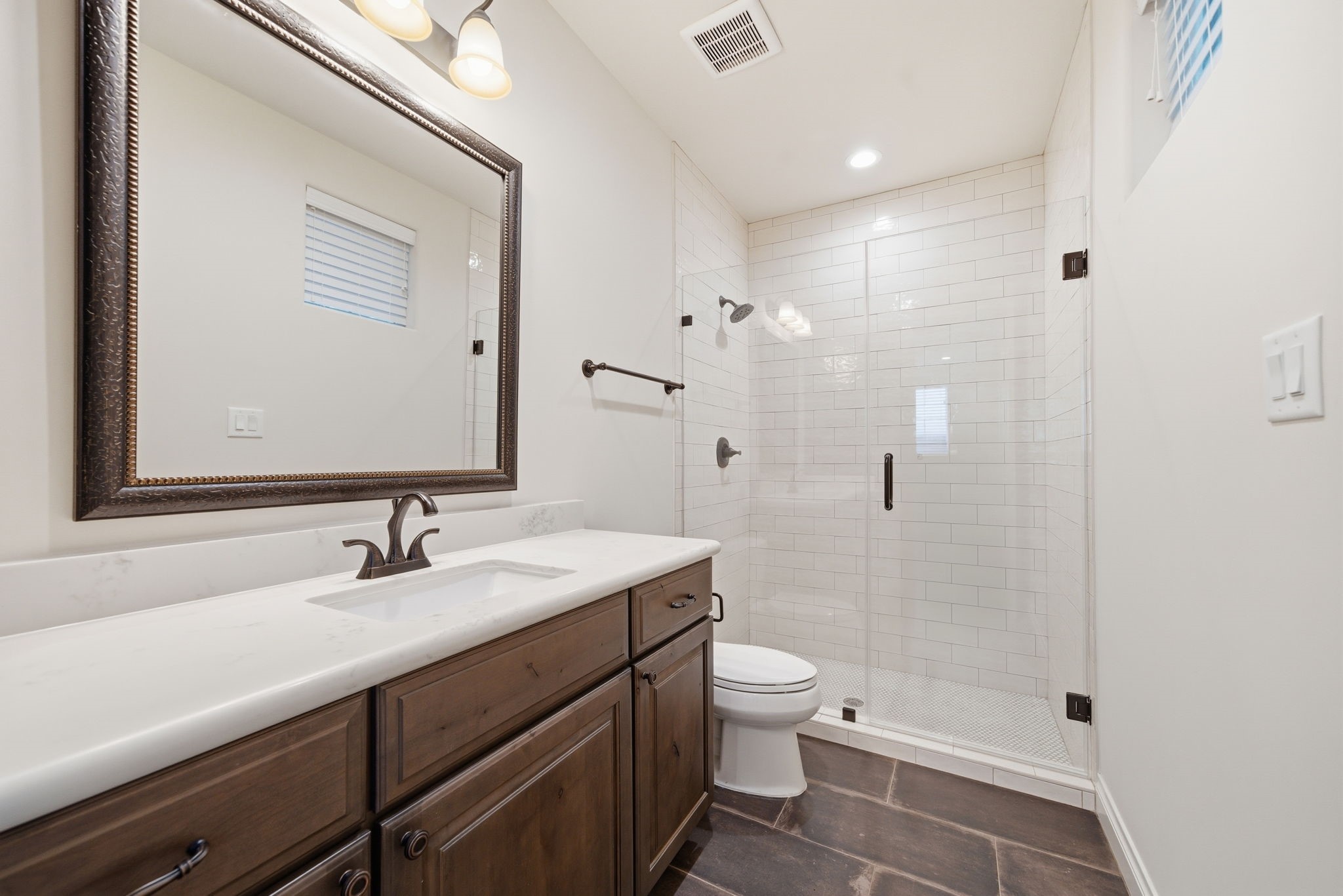 4224 Gibson Street Houston, TX 77007 - Photo 4 of 22 a bathroom with a sink a toilet and shower