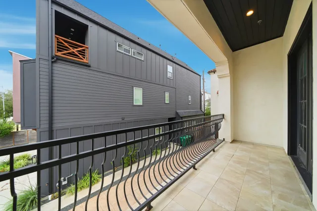 a view of balcony with furniture