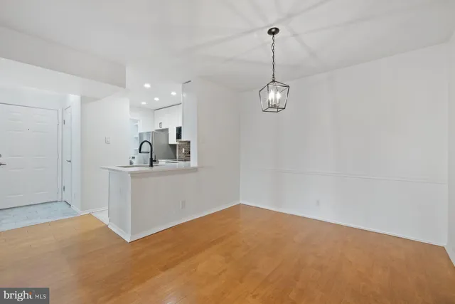 a view of a room with cabinet and chandelier