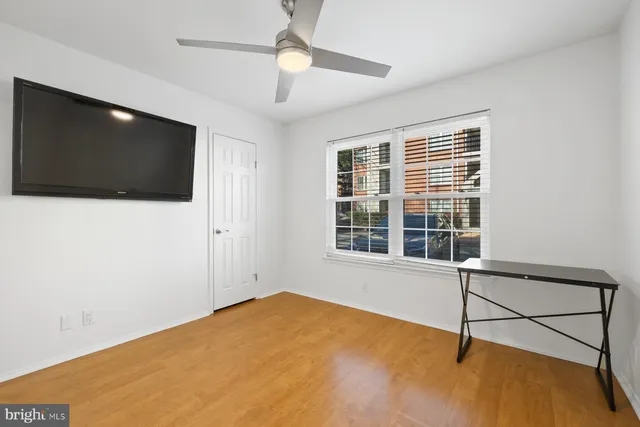 a view of an empty room with a window