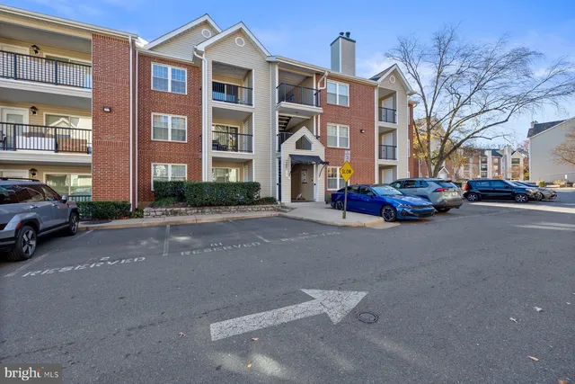 a cars parked in front of brick building
