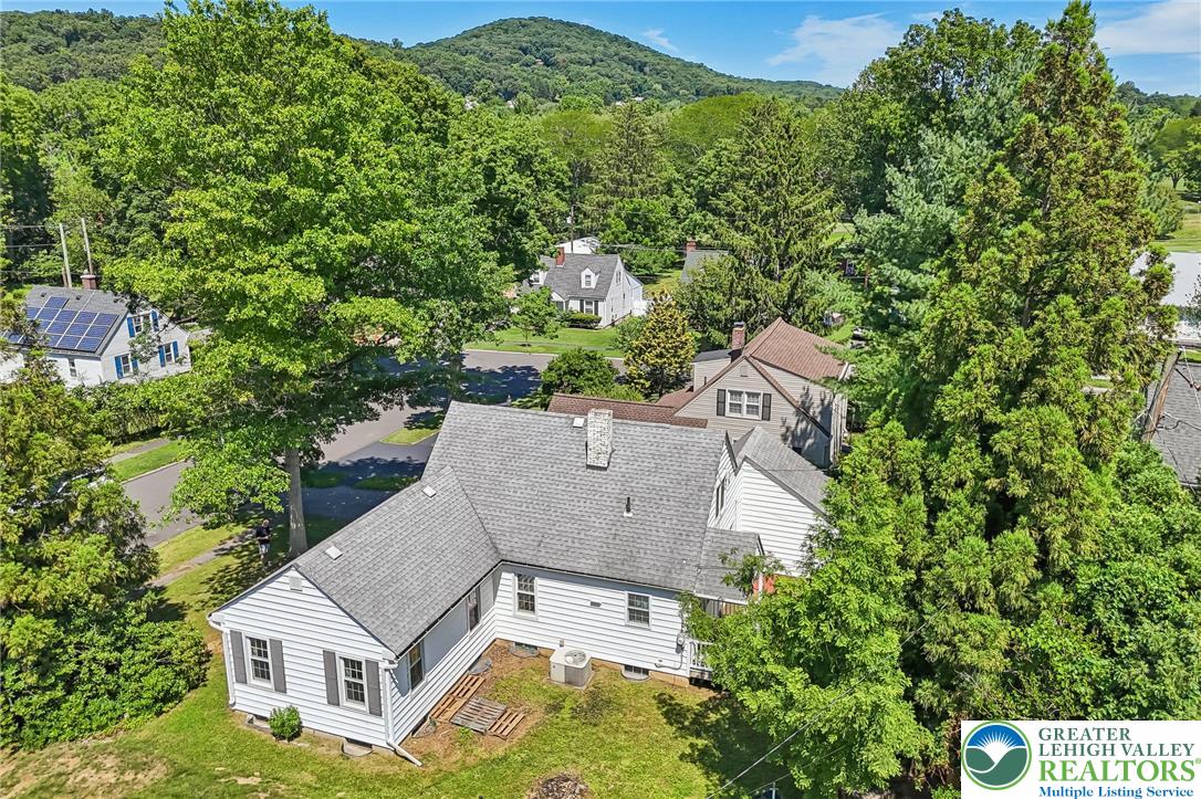 974 Juniper Road Hellertown, PA 18055 - Photo 40 of 48 Perched on an inviting lot, this charming residence offers a peaceful suburban lifestyle with distant mountain views.