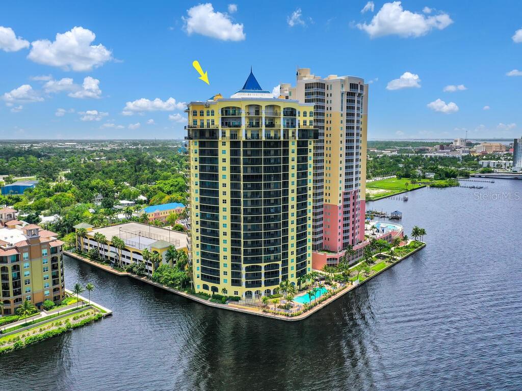 2797 First Street, Unit 1605 Fort Myers, FL 33916 - Photo 1 of 38 a view of a balcony with floor to ceiling windows and outdoor kitchen