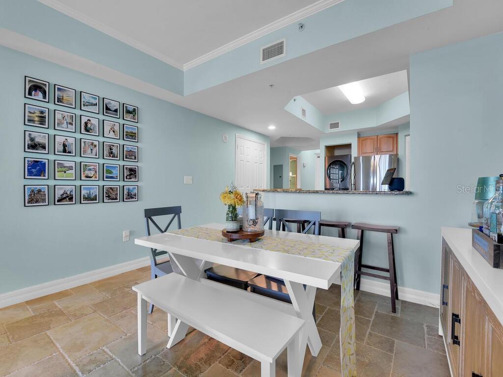 2797 First Street, Unit 1605 Fort Myers, FL 33916 - Photo 12 of 38 a workspace with a table and chairs