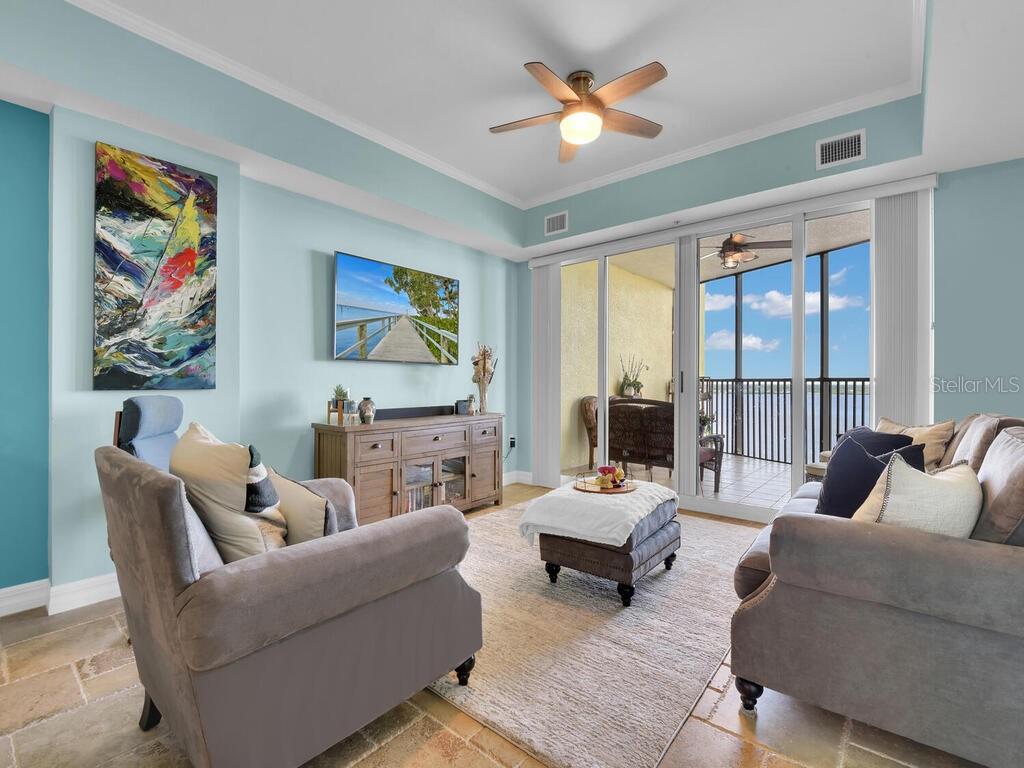 2797 First Street, Unit 1605 Fort Myers, FL 33916 - Photo 13 of 38 a living room with furniture or couch and a large window