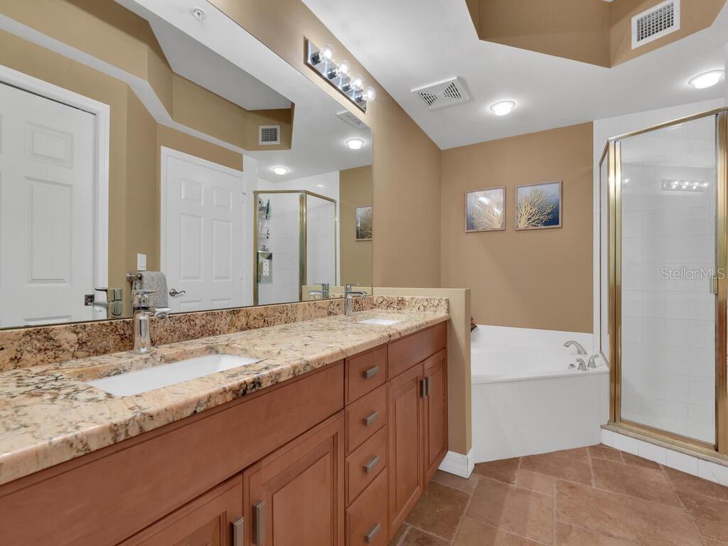 2797 First Street, Unit 1605 Fort Myers, FL 33916 - Photo 19 of 38 a bathroom with a granite countertop sink mirror and double