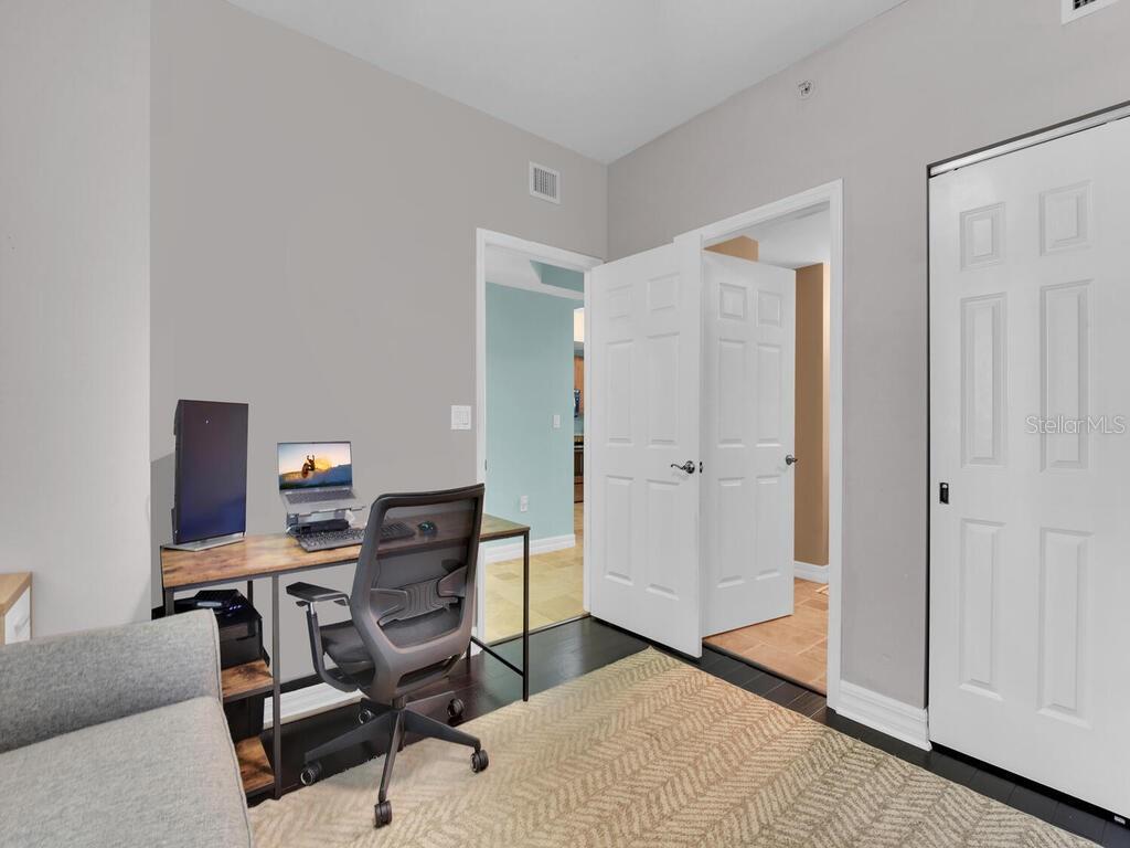 2797 First Street, Unit 1605 Fort Myers, FL 33916 - Photo 21 of 38 a view of a workspace with furniture and a window