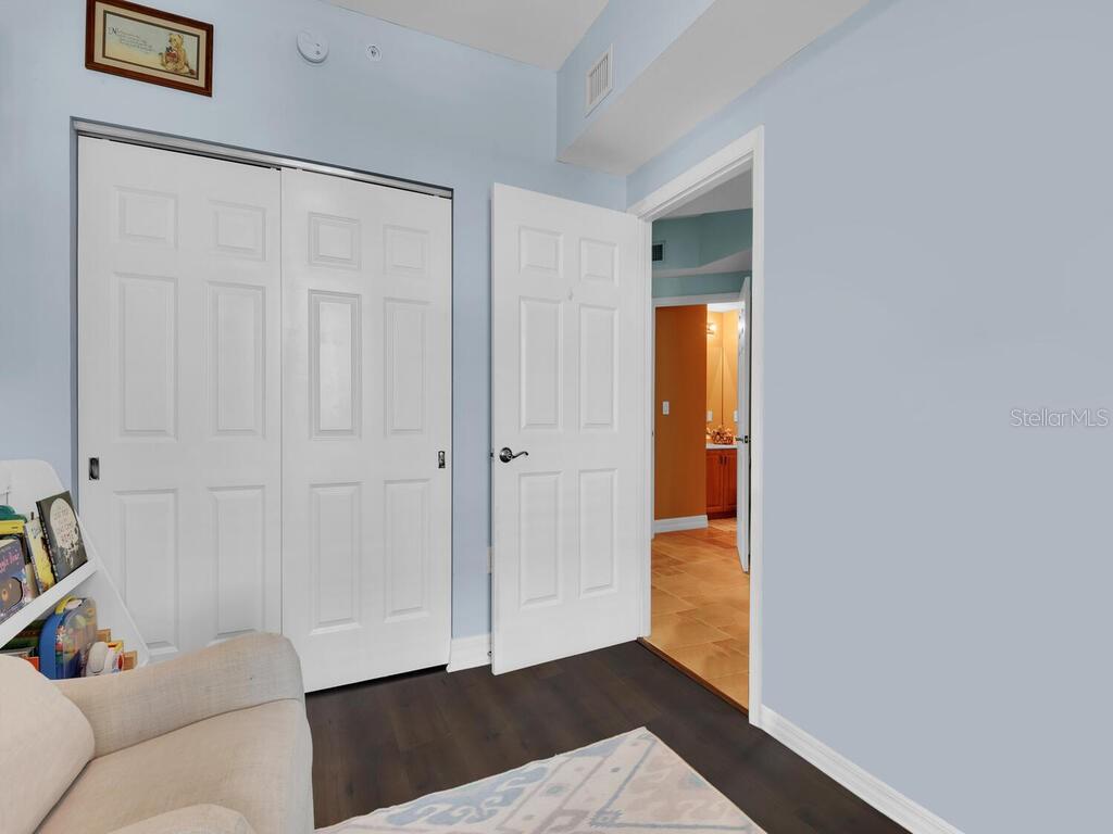 2797 First Street, Unit 1605 Fort Myers, FL 33916 - Photo 24 of 38 a view of a room with wooden floor and closet