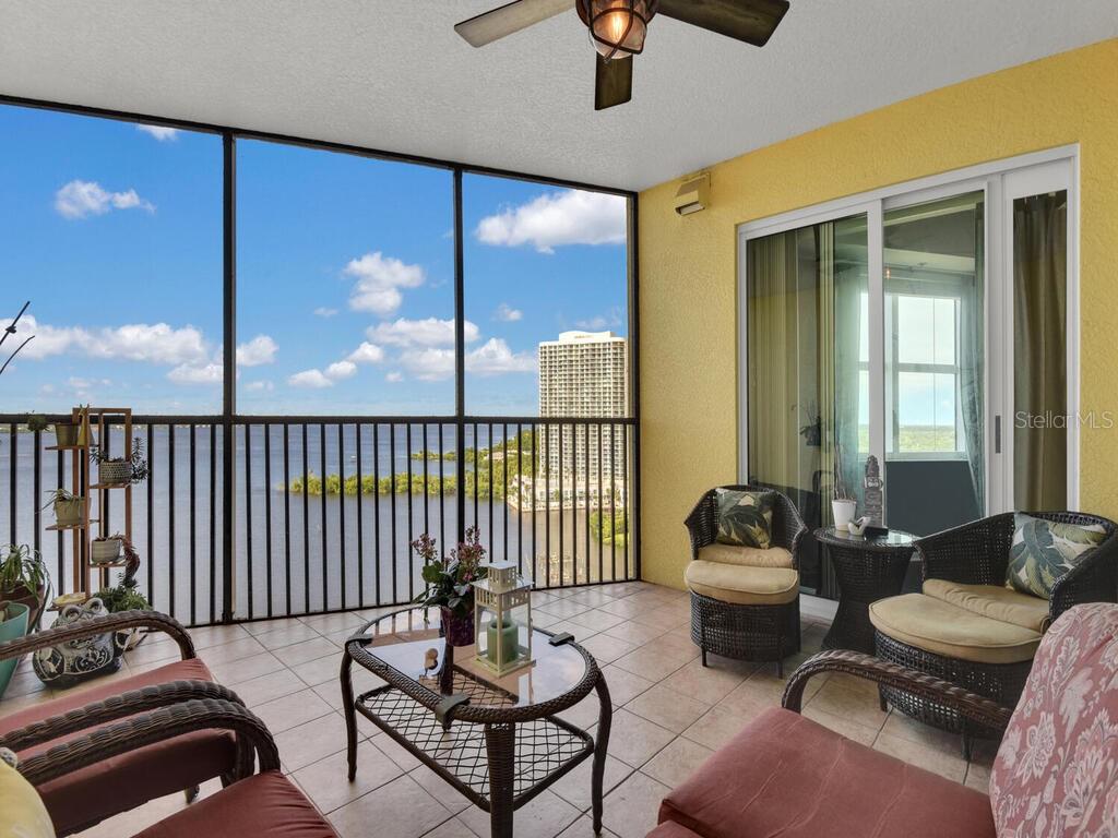 2797 First Street, Unit 1605 Fort Myers, FL 33916 - Photo 25 of 38 a living room with furniture and wooden floor