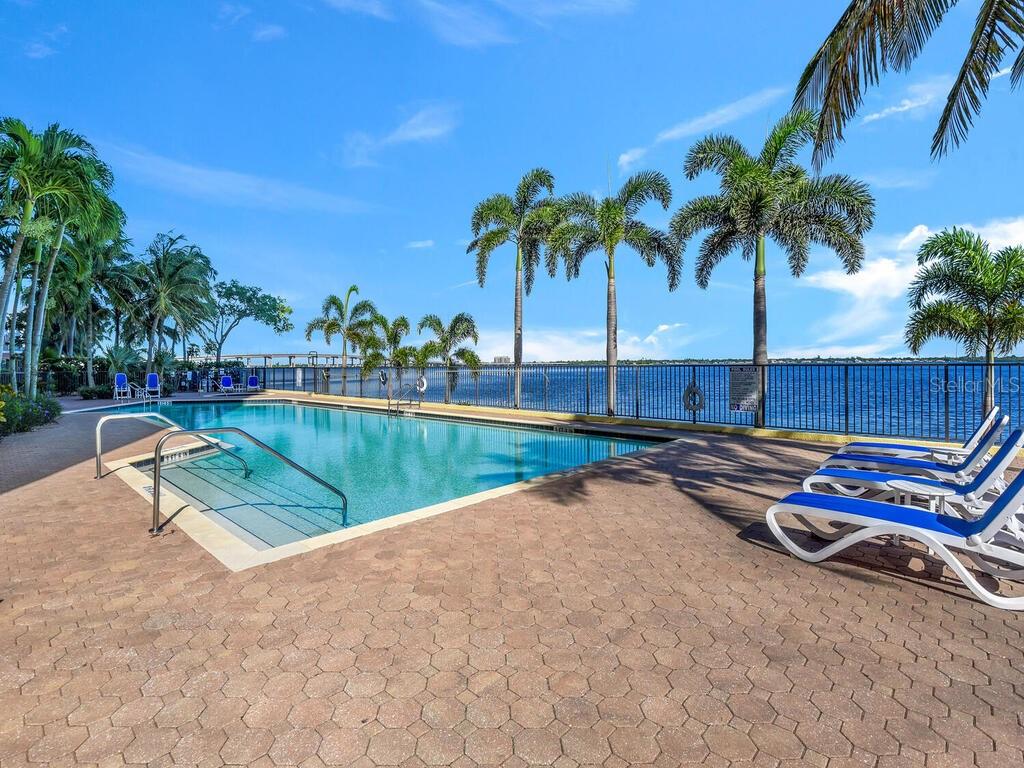 2797 First Street, Unit 1605 Fort Myers, FL 33916 - Photo 30 of 38 an outdoor space with pool and furniture