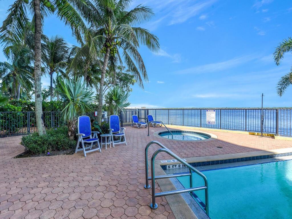2797 First Street, Unit 1605 Fort Myers, FL 33916 - Photo 32 of 38 a view of a chairs and table in patio