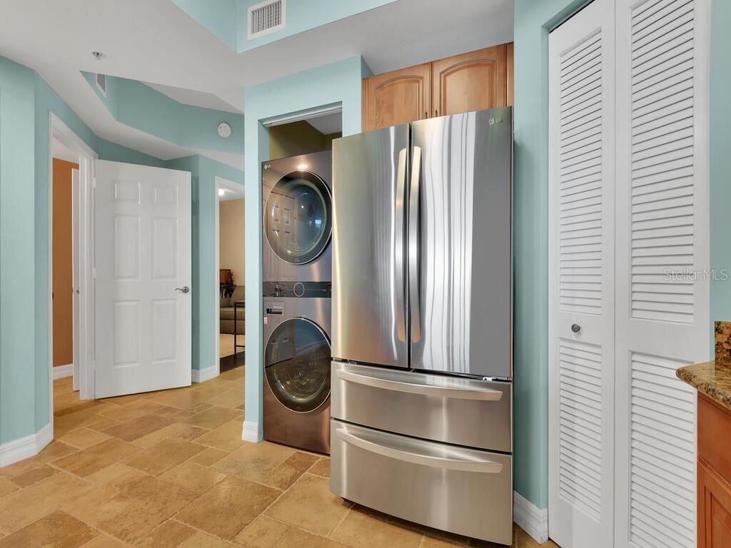 2797 First Street, Unit 1605 Fort Myers, FL 33916 - Photo 10 of 38 a view of walk in closet with clothes and shoes