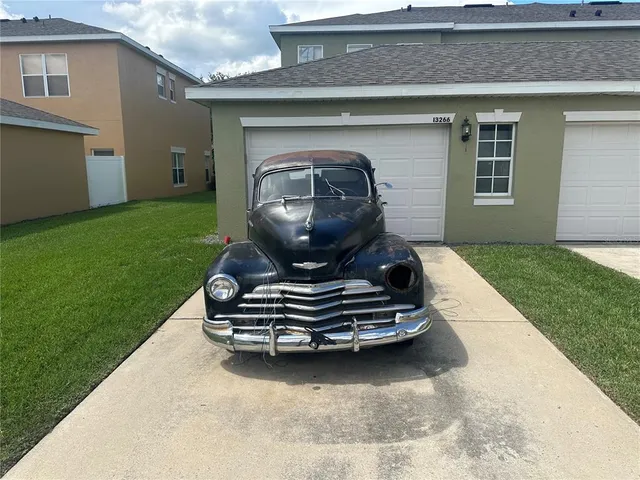 a car parked in front of a house
