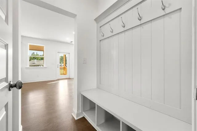 a view of hallway with wooden floor
