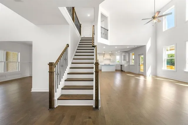a view of entryway and hall with wooden floor