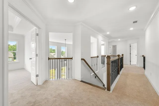 a view of a hallway with staircase