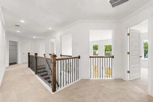 a view of a hallway with windows