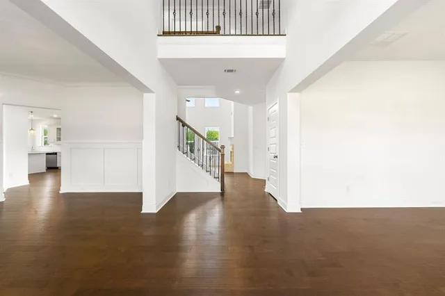 a view of an entryway with wooden floor